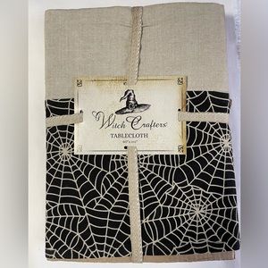 NWT.  HALLOWEEN TABLECLOTH.    Witch Crafters.   60” x 102”.   Machine washable